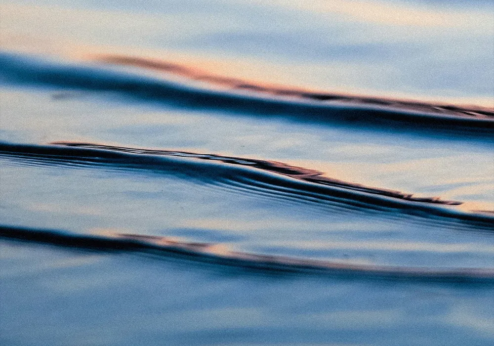 sff-mental-health-bg Close-up of rippling blue water at sunset.